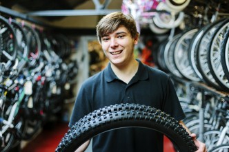 Image of bike shop and owner